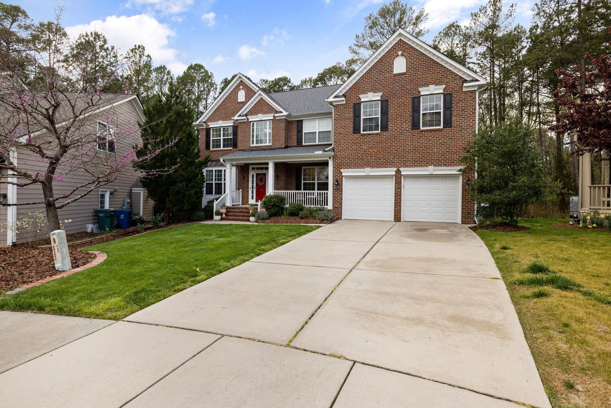 1621 Timber Wolf Drive Durham, NC 27713 - Photo 3 of 48 a front view of a house with a yard