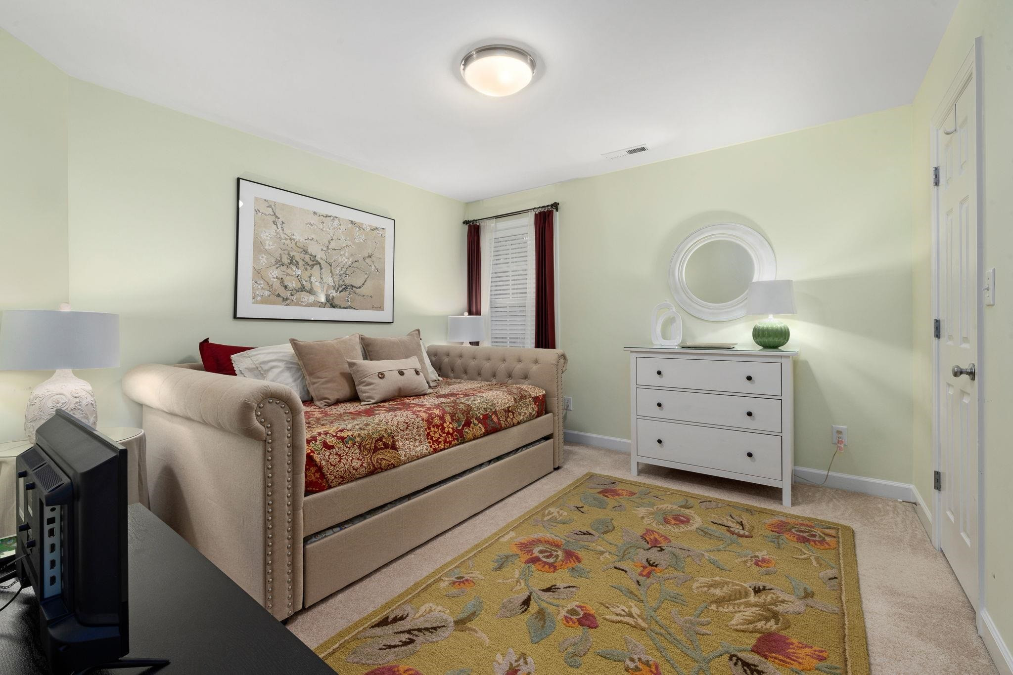 1621 Timber Wolf Drive Durham, NC 27713 - Photo 31 of 48 a living room with furniture and a dresser