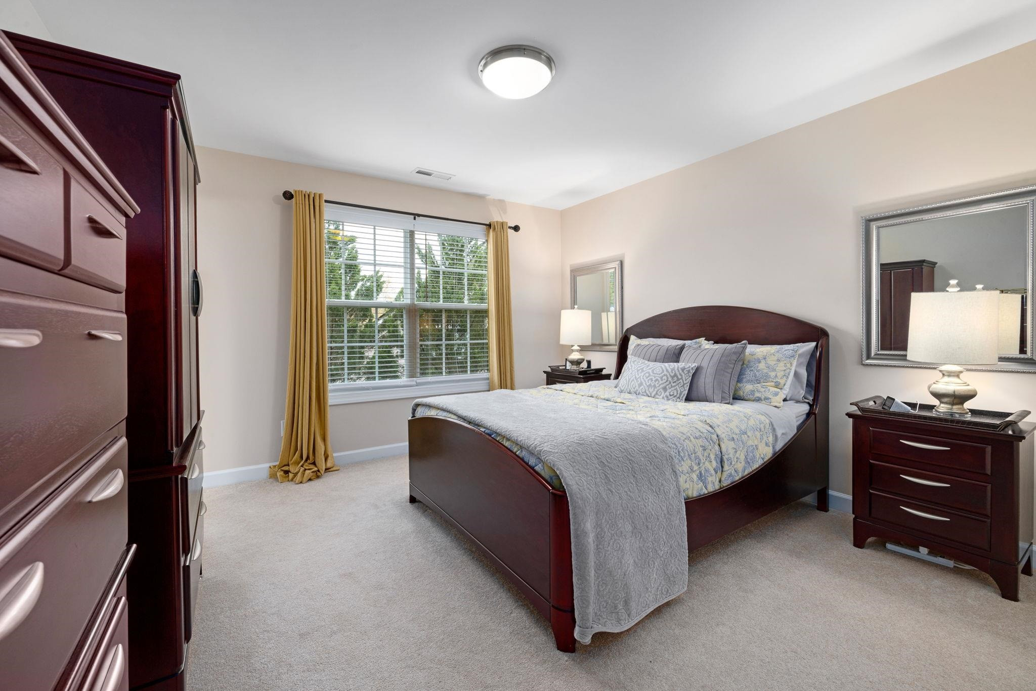 1621 Timber Wolf Drive Durham, NC 27713 - Photo 32 of 48 a bedroom with a bed dresser and a window