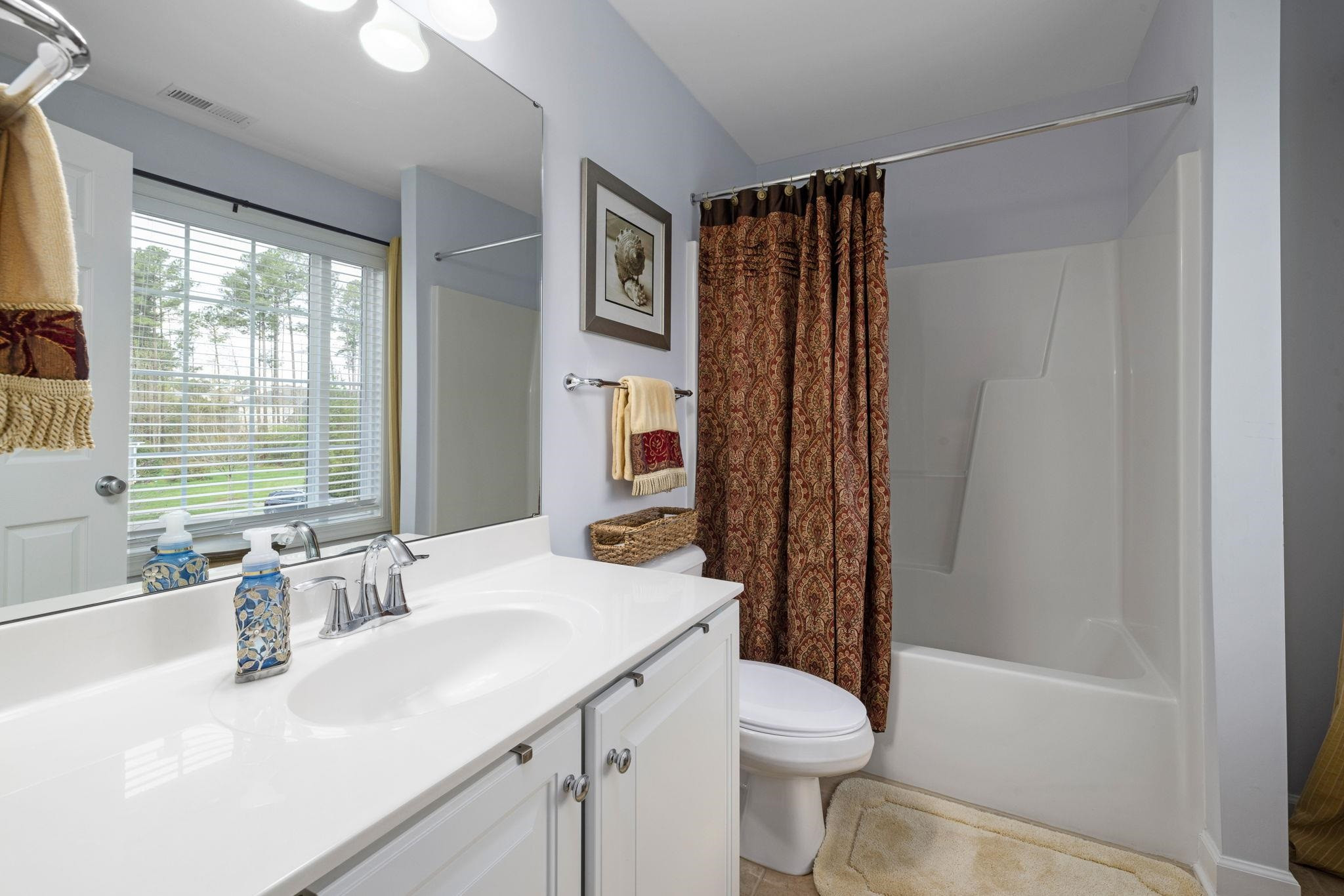 1621 Timber Wolf Drive Durham, NC 27713 - Photo 33 of 48 a bathroom with a sink toilet and shower