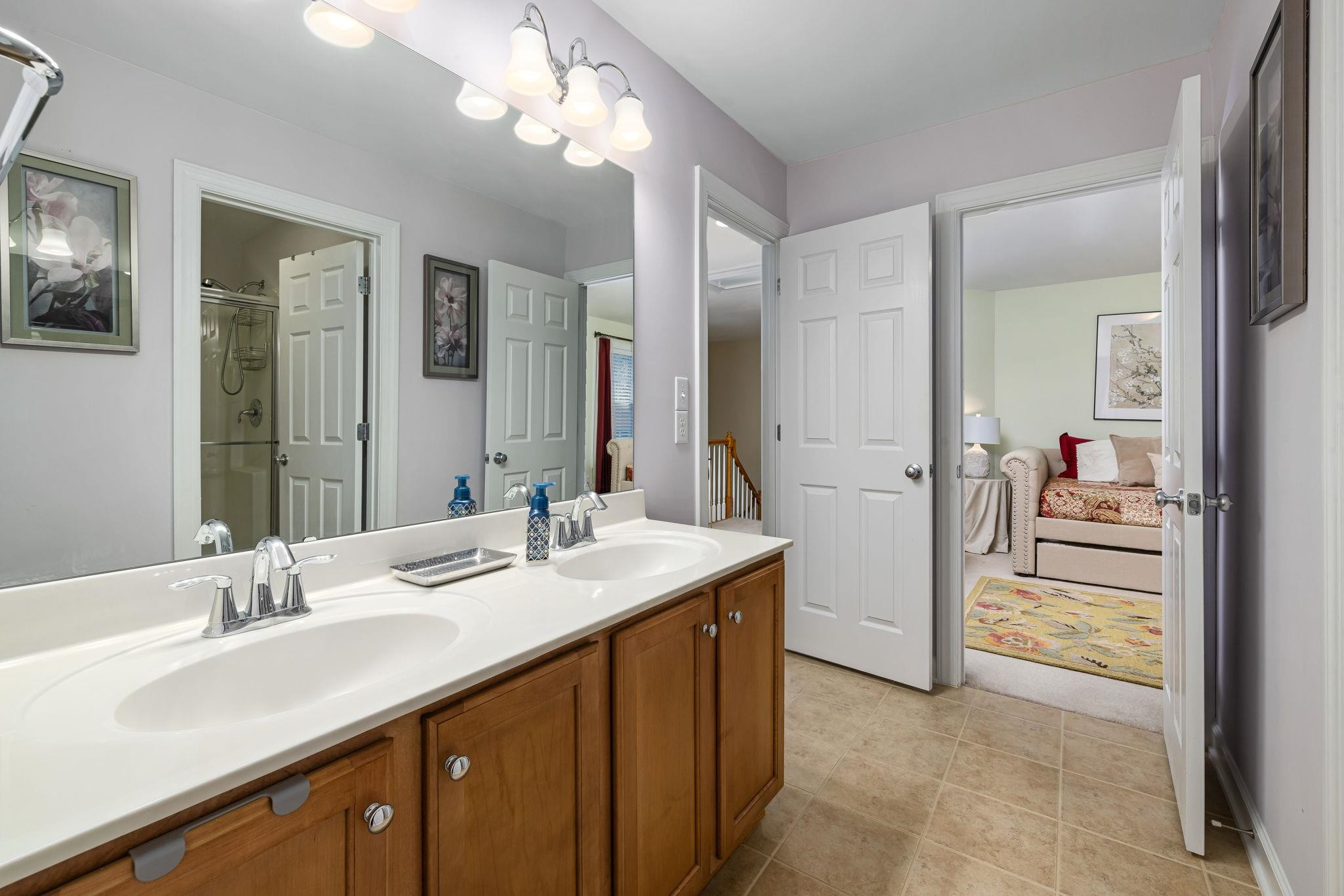 1621 Timber Wolf Drive Durham, NC 27713 - Photo 34 of 48 a en suite bathroom with a sink a mirror and a shower