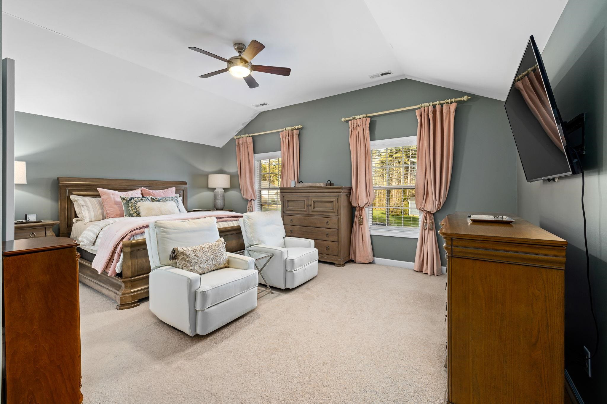 1621 Timber Wolf Drive Durham, NC 27713 - Photo 37 of 48 a bedroom with furniture and a flat screen tv