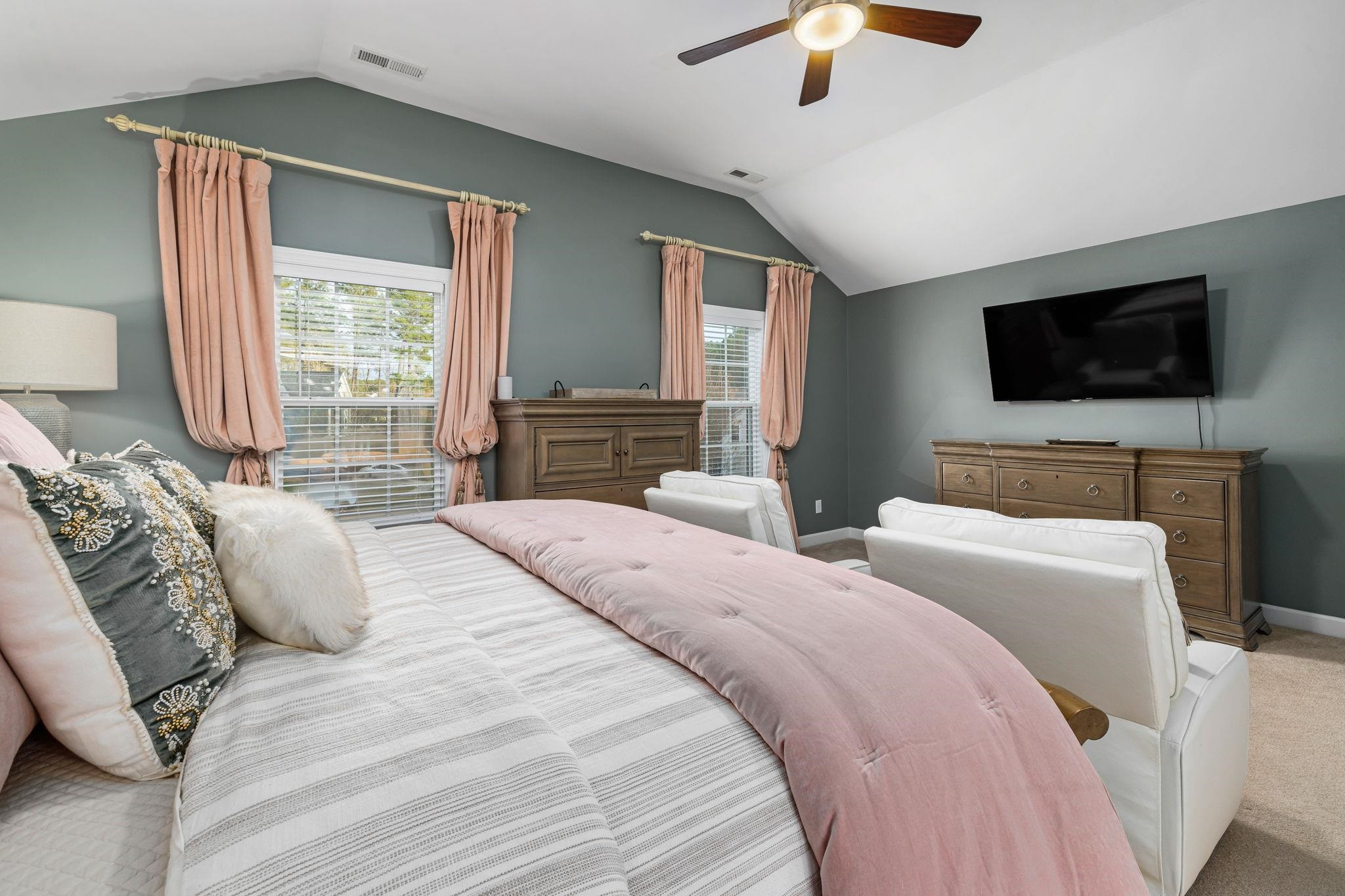 1621 Timber Wolf Drive Durham, NC 27713 - Photo 39 of 48 a bedroom with a bed and a flat screen tv