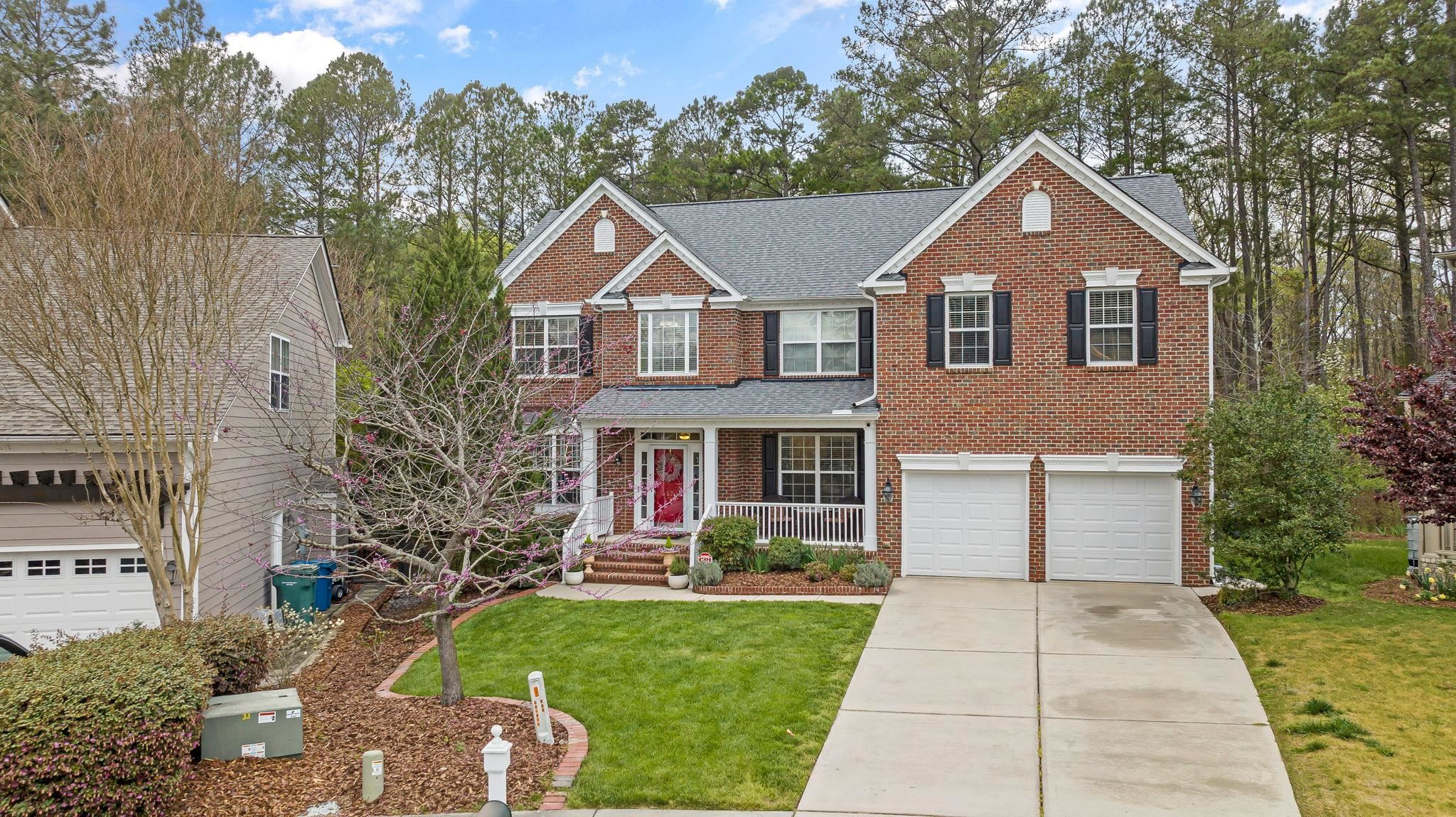 1621 Timber Wolf Drive Durham, NC 27713 - Photo 4 of 48 a front view of a house with a yard