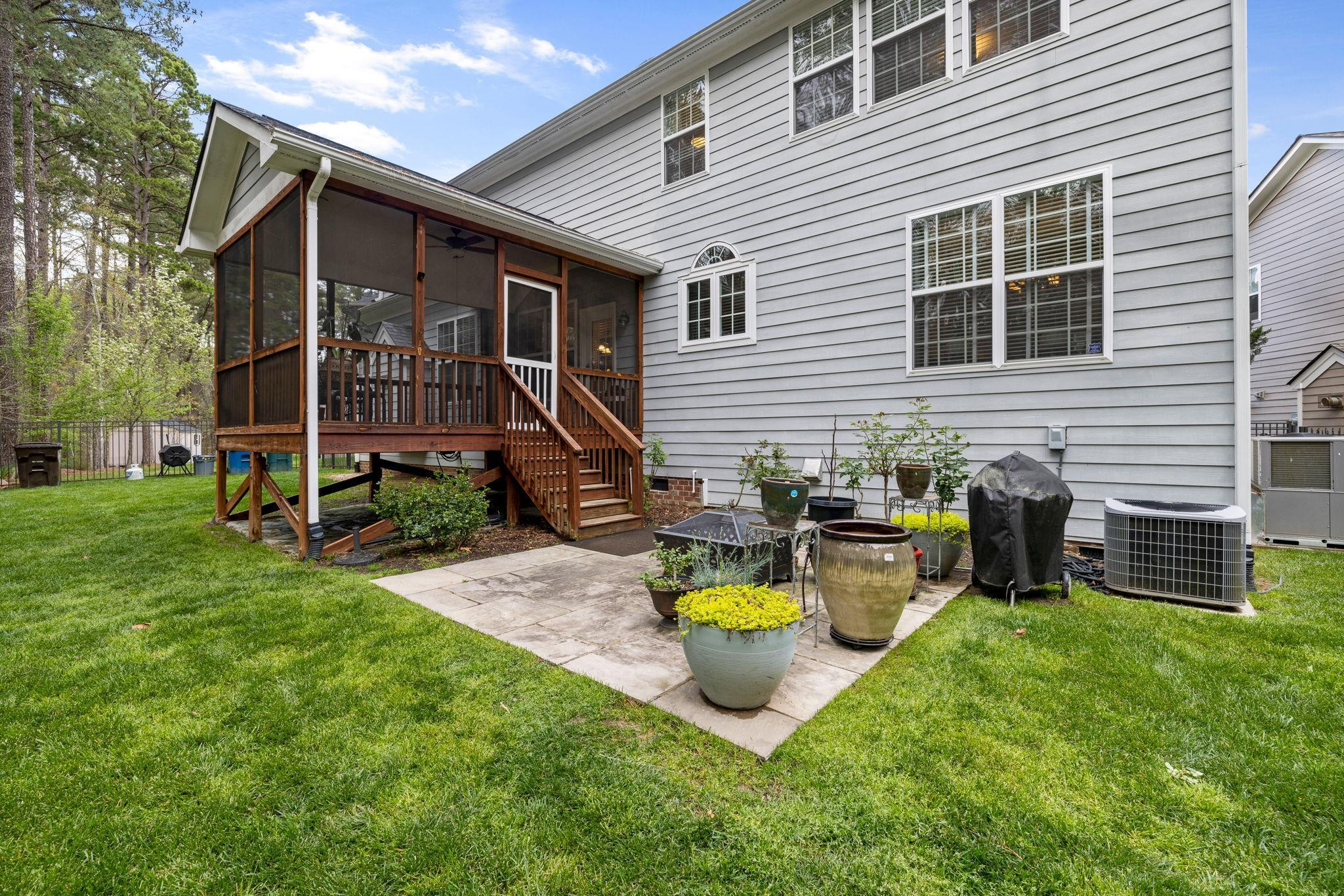 1621 Timber Wolf Drive Durham, NC 27713 - Photo 46 of 48 a view of a house with backyard and sitting area