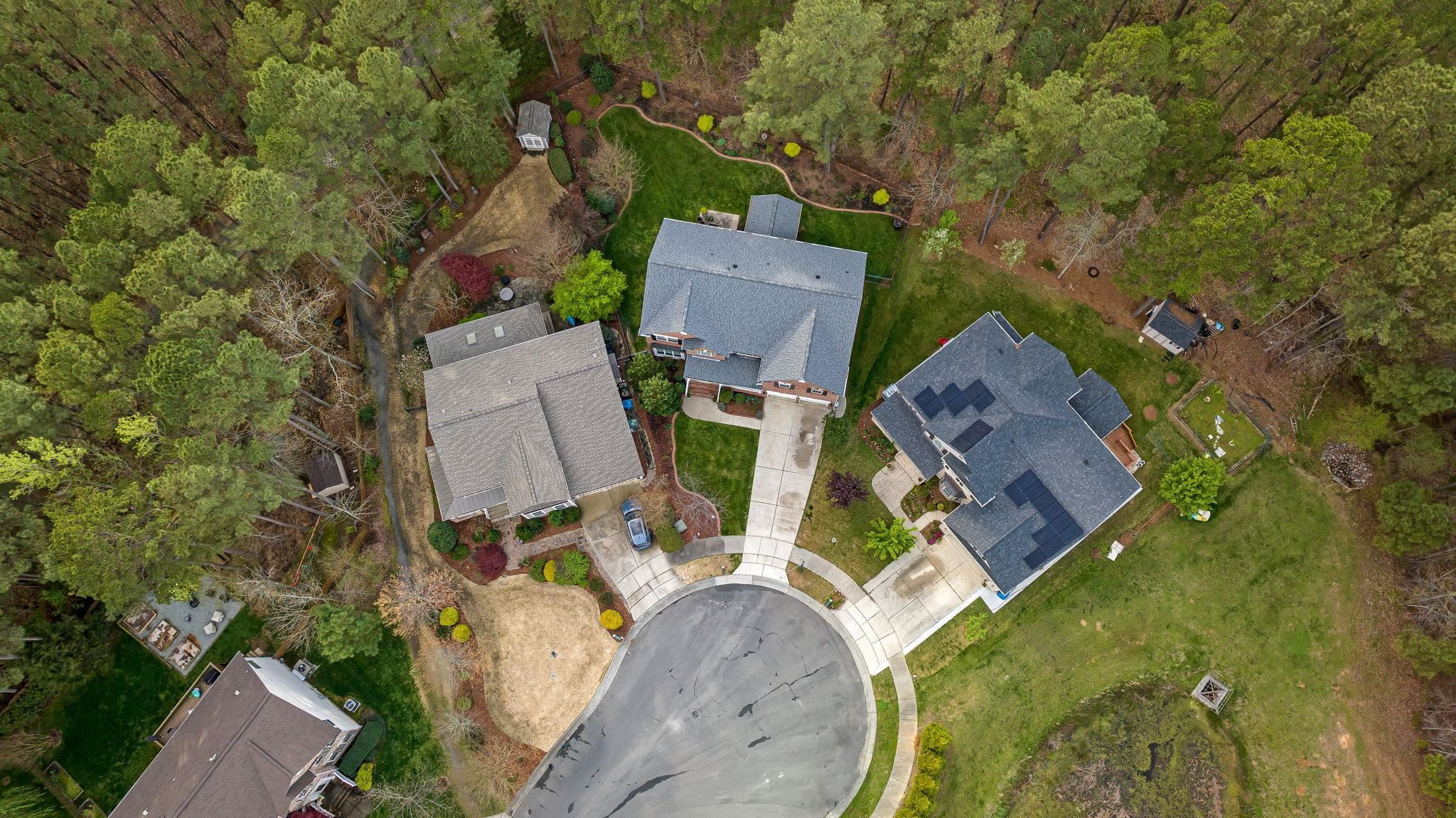 1621 Timber Wolf Drive Durham, NC 27713 - Photo 6 of 48 an aerial view of a house with outdoor space and a lake view