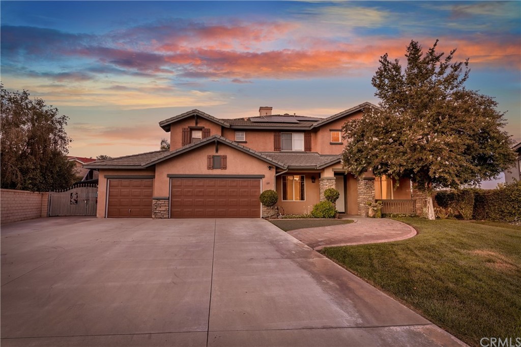 1101 Santorini Road Riverside, CA 92506 - Photo 1 of 1 a front view of a house with yard and trees