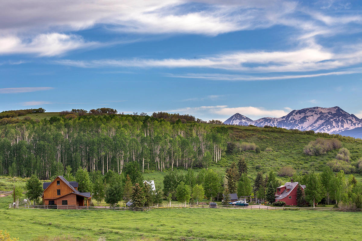 3520 County 58P Road Placerville, CO 81430 - Photo 1 of 76 a view of a lake with houses in the background