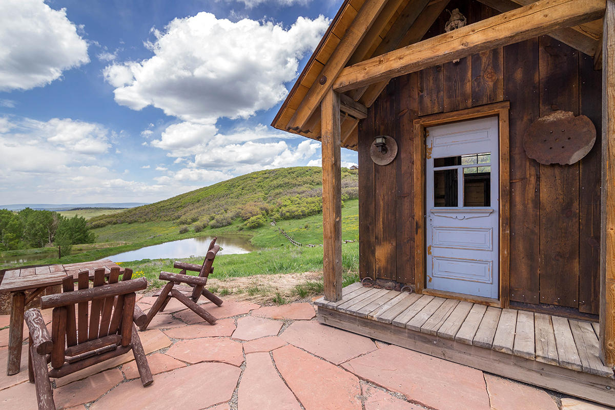 3520 County 58P Road Placerville, CO 81430 - Photo 16 of 76 a view of a house with backyard and sitting area