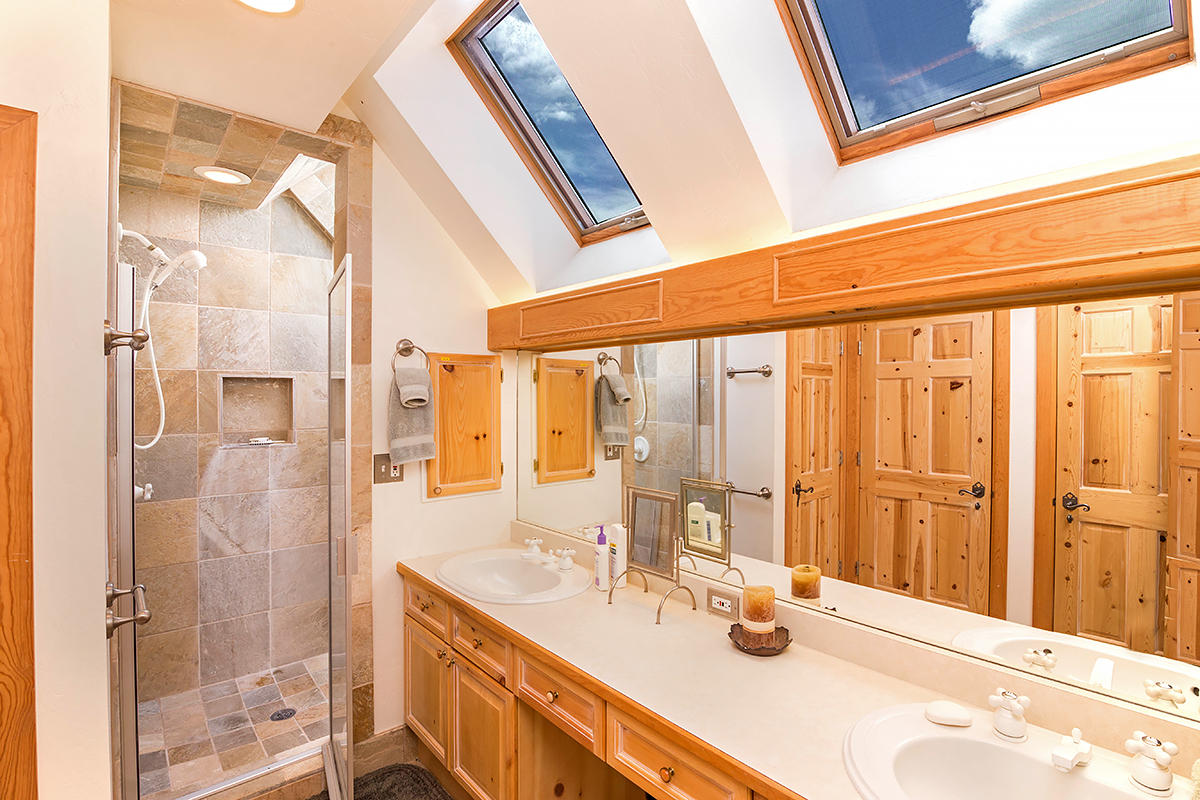 3520 County 58P Road Placerville, CO 81430 - Photo 33 of 76 a bathroom with a double vanity sink and a shower