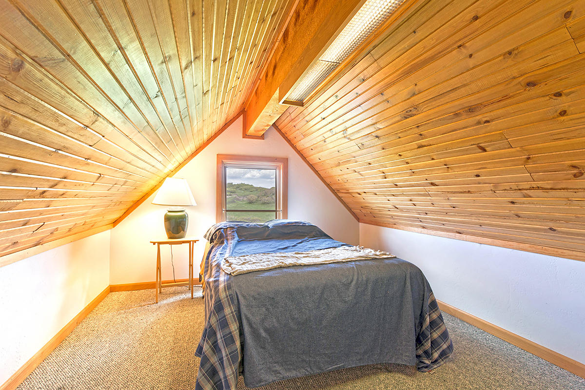 3520 County 58P Road Placerville, CO 81430 - Photo 34 of 76 a bedroom with a bed and a night stand