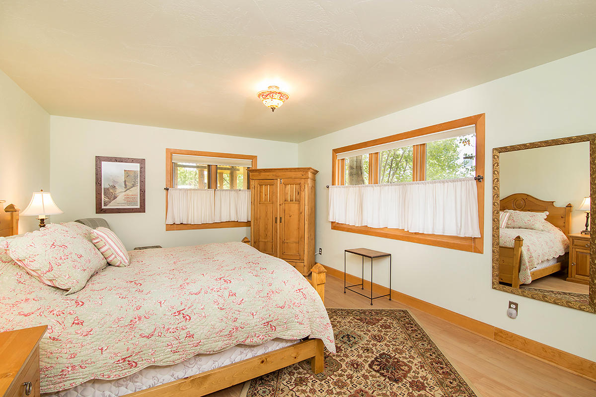 3520 County 58P Road Placerville, CO 81430 - Photo 40 of 76 a bedroom with a large bed and a window