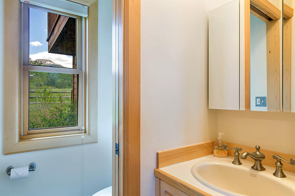3520 County 58P Road Placerville, CO 81430 - Photo 45 of 76 a bathroom with a sink and a mirror