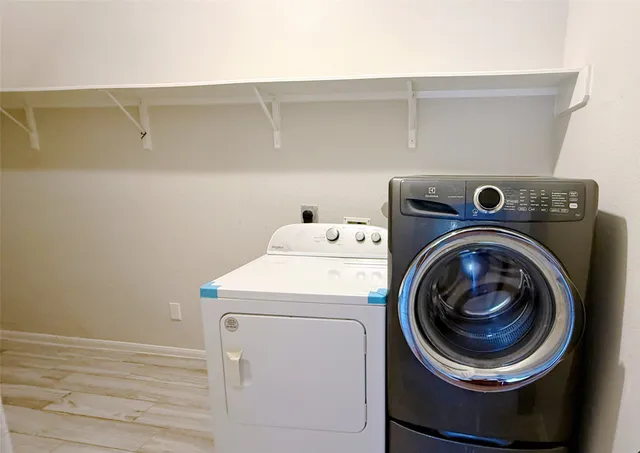 a utility room with dryer and washer