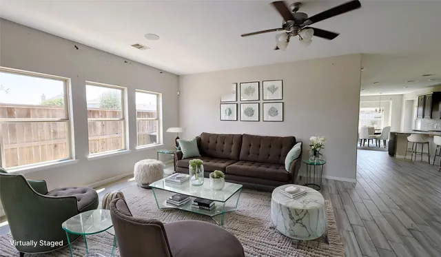 a living room with furniture and a large window