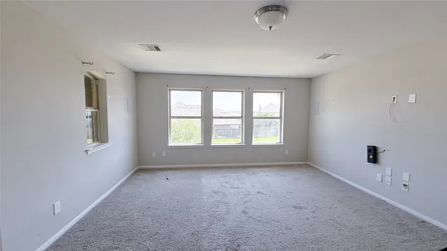 a big room with windows and closet