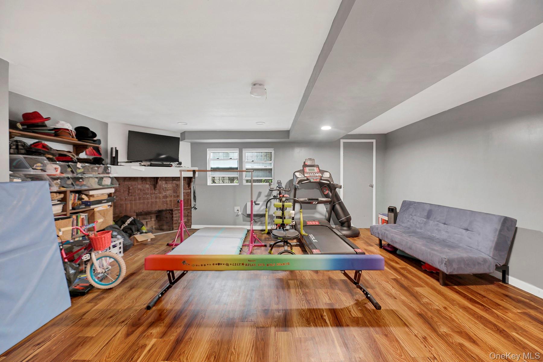 179-50 Anderson Road Queens, NY 11434 - Photo 20 of 23 Living area with wood finished floors, a fireplace, and recessed lighting