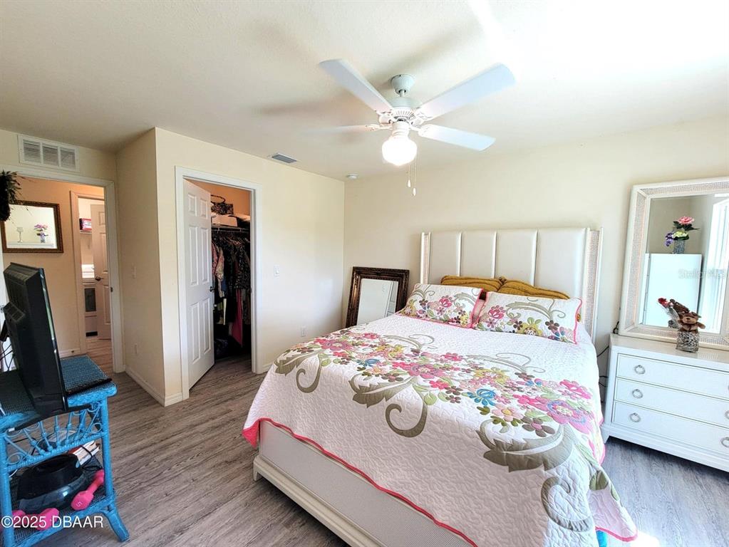 5023 Littlefield Road LaBelle, FL 33935 - Photo 17 of 36 a bedroom with a bed and a dresser