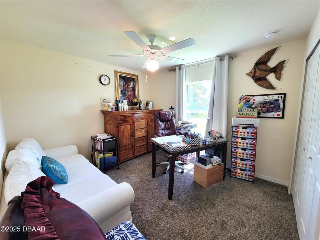 5023 Littlefield Road LaBelle, FL 33935 - Photo 21 of 36 a living room with furniture and a window
