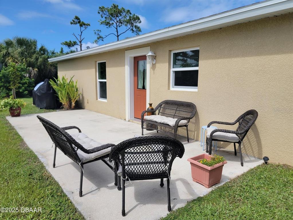 5023 Littlefield Road LaBelle, FL 33935 - Photo 24 of 36 a view of a patio with couple of chairs