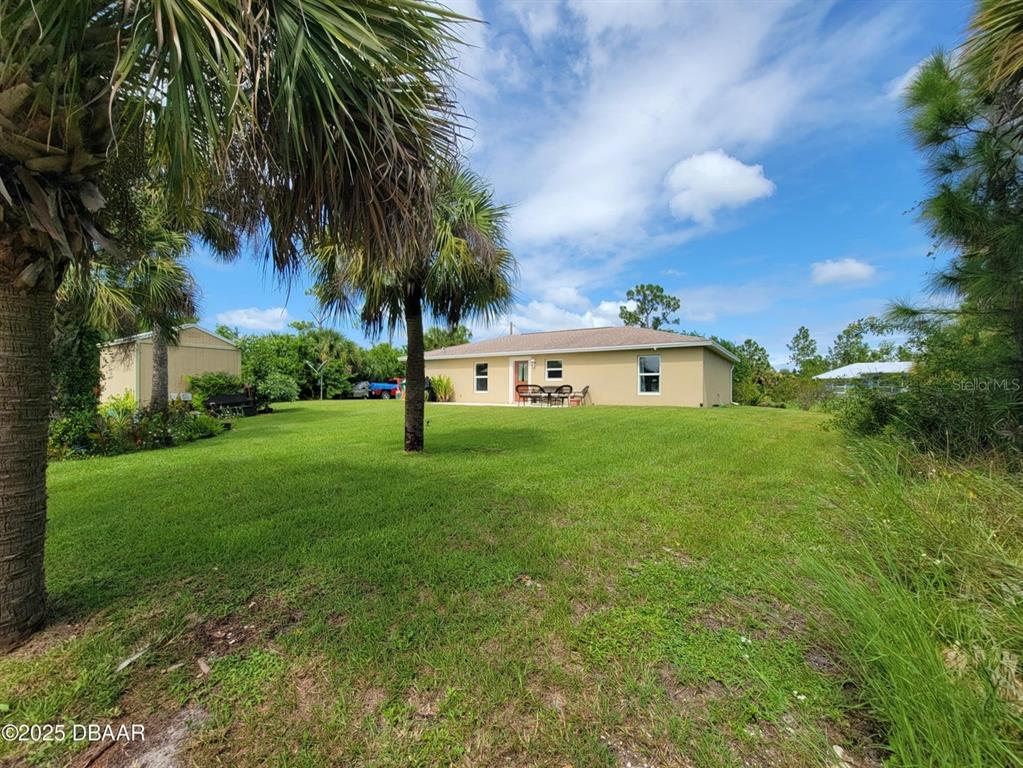 5023 Littlefield Road LaBelle, FL 33935 - Photo 27 of 36 a front view of a house with garden