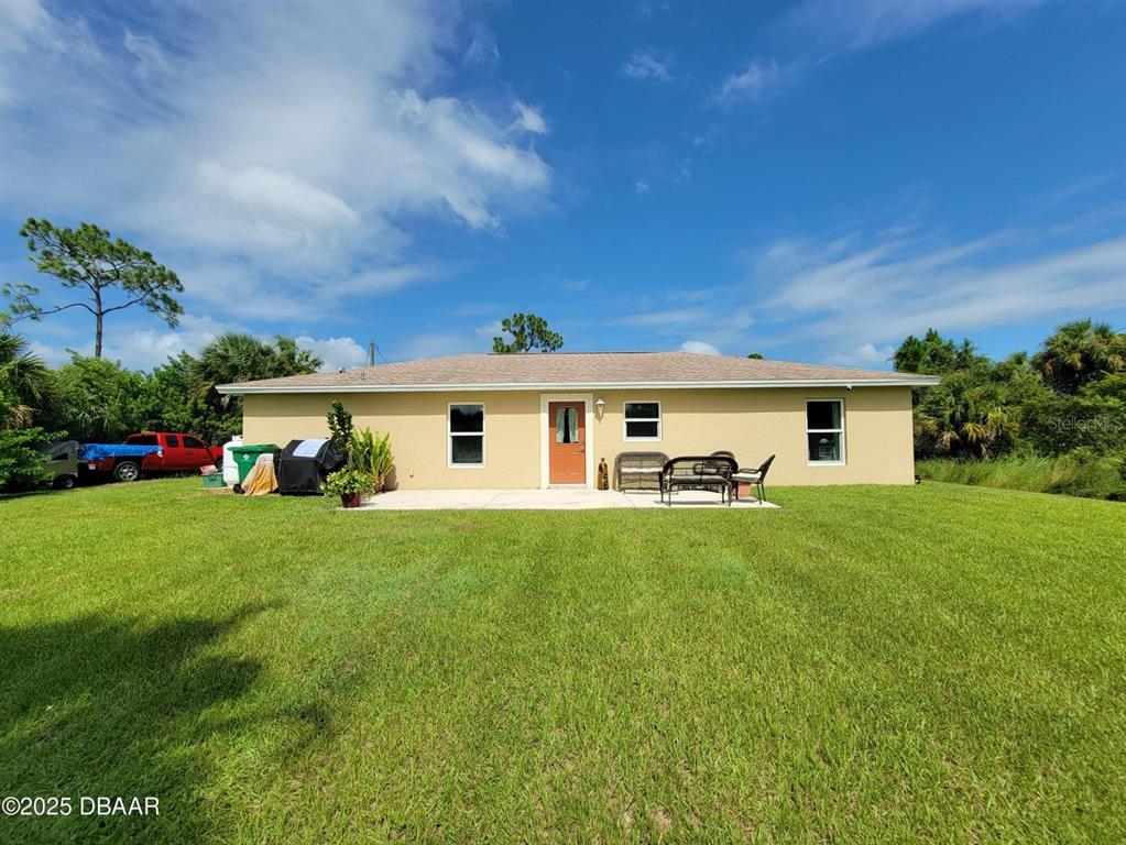 5023 Littlefield Road LaBelle, FL 33935 - Photo 28 of 36 a front view of a house with a garden