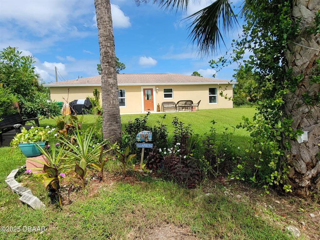 5023 Littlefield Road LaBelle, FL 33935 - Photo 35 of 36 a front view of a house with a yard