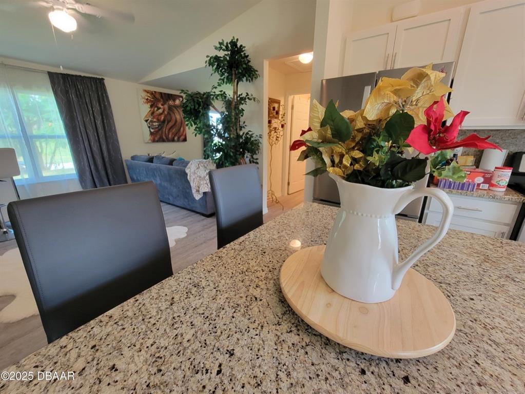 5023 Littlefield Road LaBelle, FL 33935 - Photo 8 of 36 a vase of flowers sitting on a table