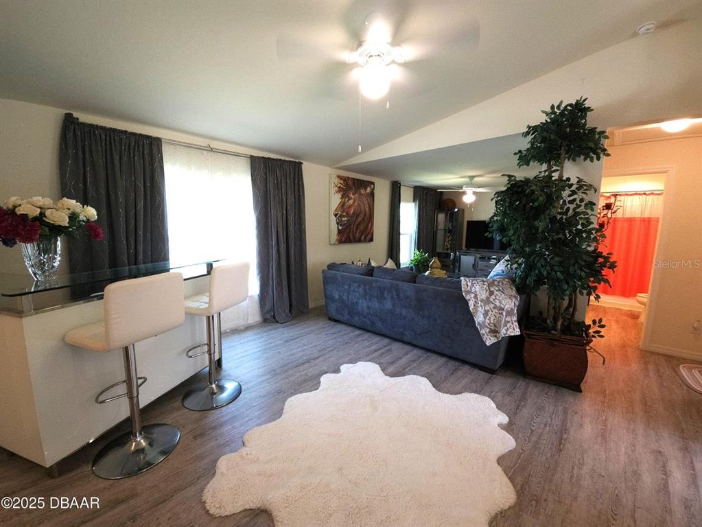 5023 Littlefield Road LaBelle, FL 33935 - Photo 10 of 36 a living room with furniture and a chandelier