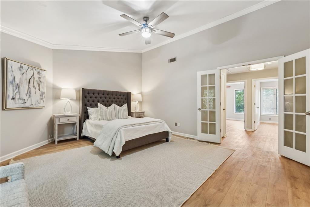 4010 Roswell Road Northeast, Unit A2 Atlanta, GA 30342 - Photo 17 of 30 a bed room with a bed and a chandelier