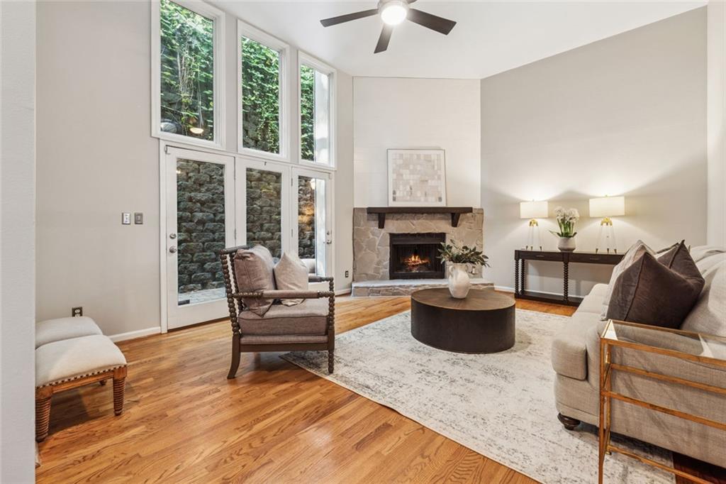 4010 Roswell Road Northeast, Unit A2 Atlanta, GA 30342 - Photo 2 of 30 a living room with furniture and a fireplace