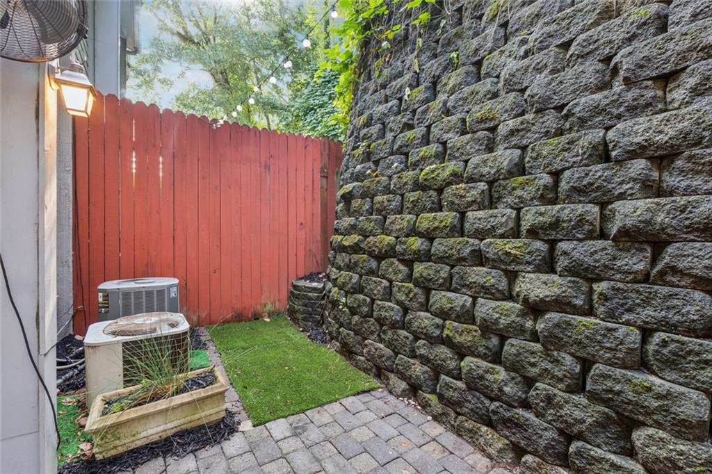 4010 Roswell Road Northeast, Unit A2 Atlanta, GA 30342 - Photo 21 of 30 a view of a backyard with wooden fence