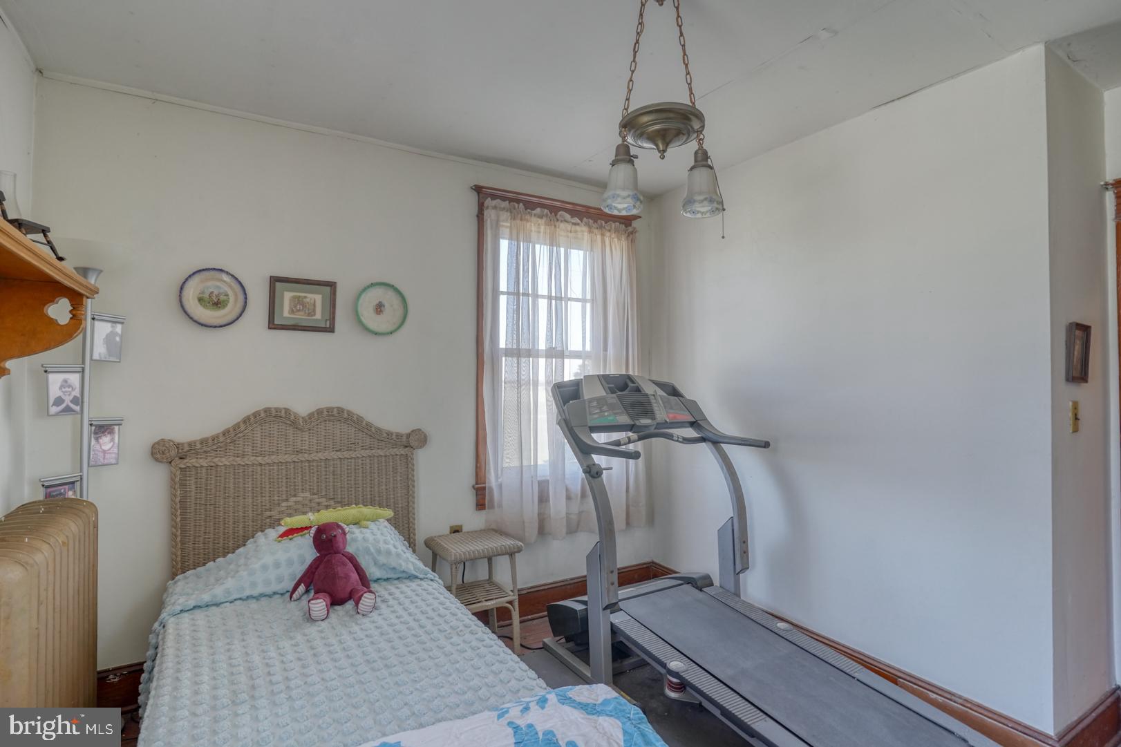4096 Main Street Trappe, MD 21673 - Photo 44 of 70 a room with wooden floor and windows