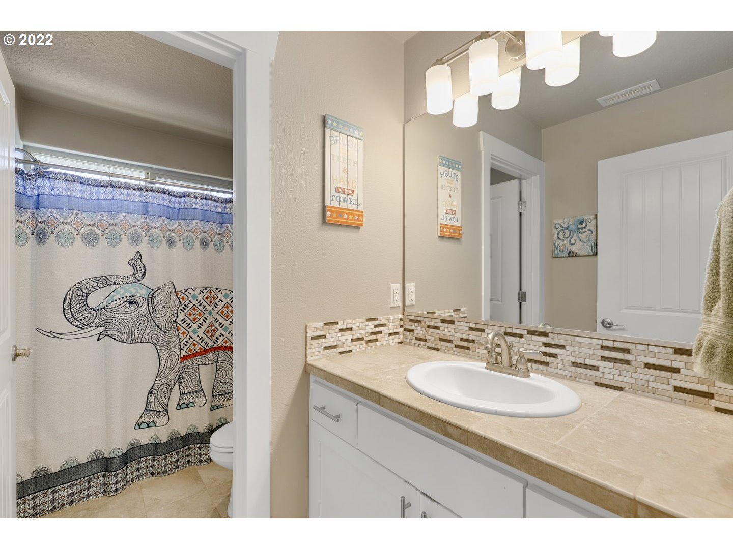 1845 South 14th Court Ridgefield, WA 98642 - Photo 24 of 32 a bathroom with a sink vanity and a mirror