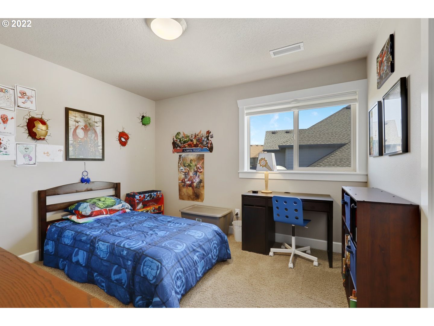 1845 South 14th Court Ridgefield, WA 98642 - Photo 25 of 32 a bedroom with a bed a table and painting on the wall