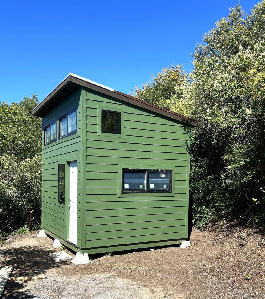 7632 Engineers Road Julian, CA 92036 - Photo 14 of 20 a small green building with a small yard