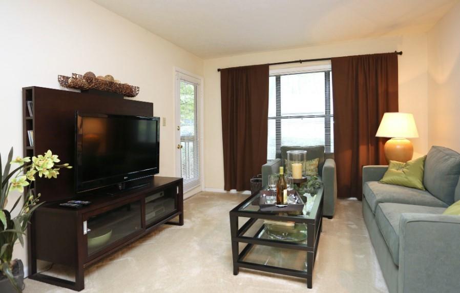3450 K Jones Mill Road, Unit 218 Norcross, GA 30092 - Photo 8 of 29 a living room with furniture and a flat screen tv