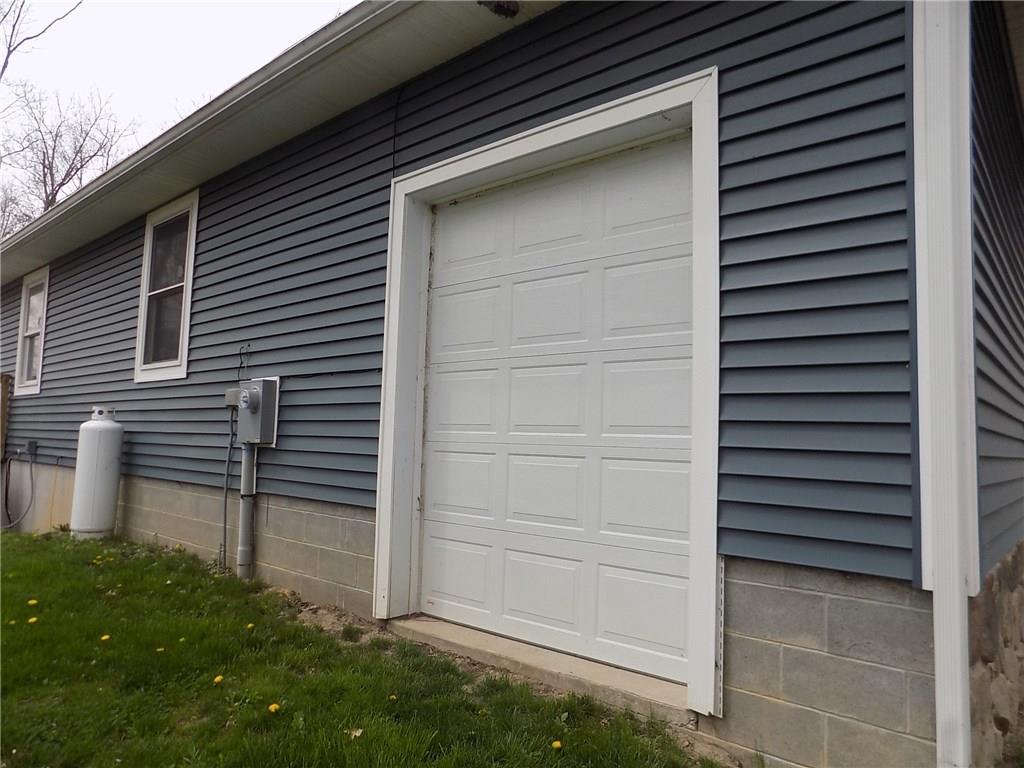 52 5 Points Road Sandy Lake, PA 16145 - Photo 24 of 24 Smaller garage door allows for easy accessibility for lawn equipment when vehicles are parked in the garage.