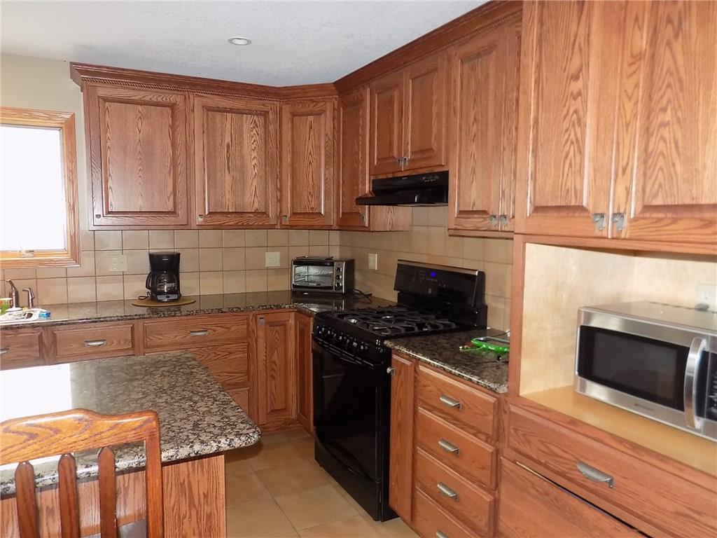 52 5 Points Road Sandy Lake, PA 16145 - Photo 6 of 24 This kitchen doesn't leave you wondering where you're going to store things! Plenty and plenty of cabinet space!