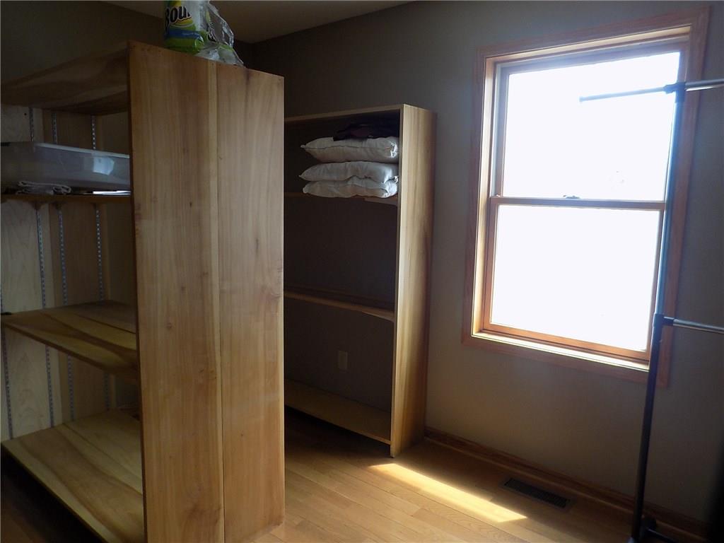 52 5 Points Road Sandy Lake, PA 16145 - Photo 8 of 24 Shelving units for extra storage or pantry feel in this laundry space.