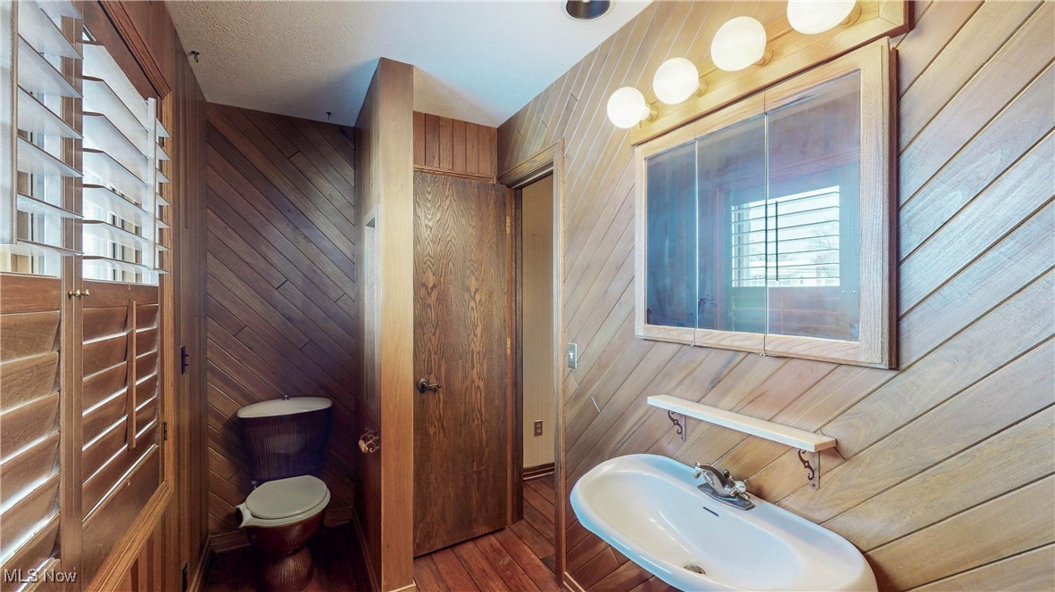 1091 Sand Run Road Akron, OH 44313 - Photo 22 of 26 This rustic full bath off the second floor landing has a separate stall shower.