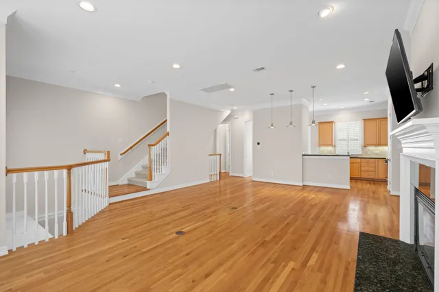 a kitchen with stainless steel appliances granite countertop a stove and a refrigerator