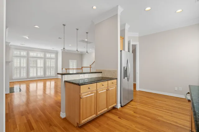 a kitchen with stainless steel appliances granite countertop a sink stove and microwave