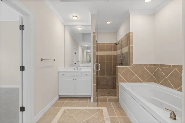 a bathroom with a bathtub and a sink