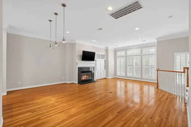 a view of a kitchen with wooden floor