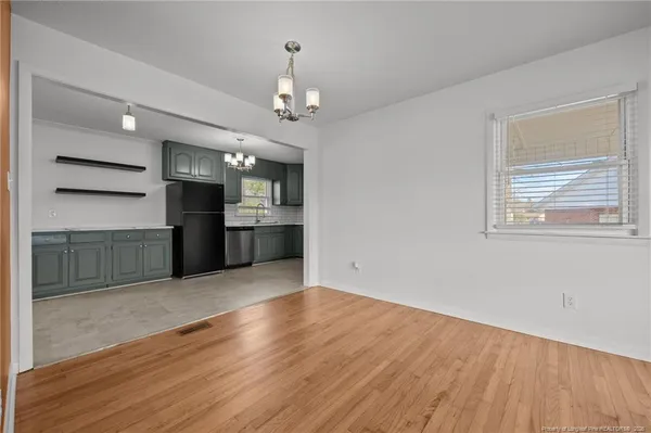 a kitchen with granite countertop cabinets stainless steel appliances and a sink