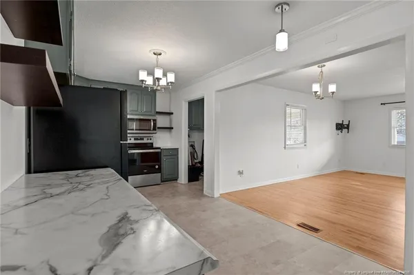 a kitchen with a refrigerator and a sink
