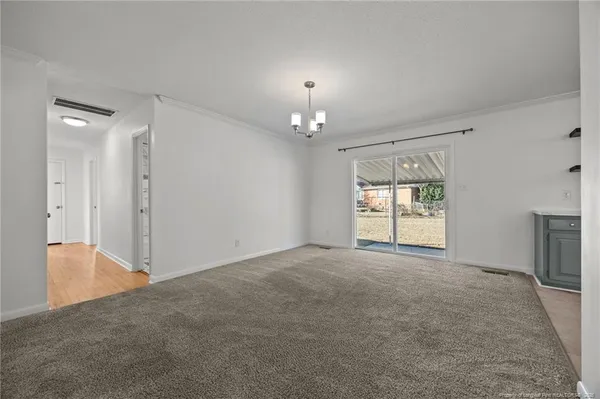 a view of hallway with wooden floor