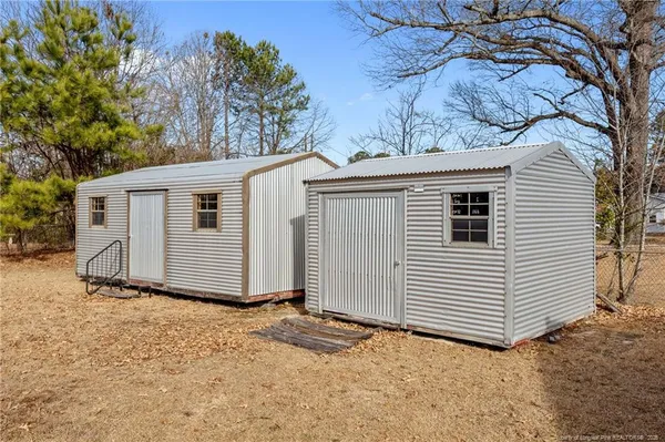 a street view with large trees