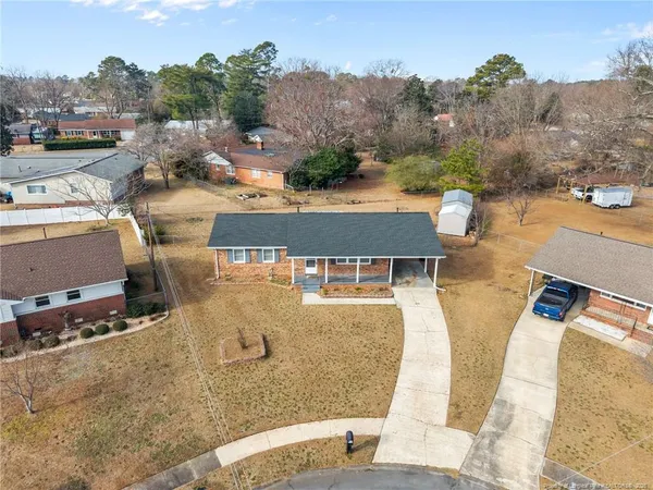 an aerial view of residential houses with outdoor space